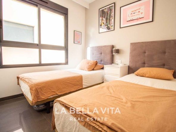 Modern Apartment with solarium for sale step away from the beach in Mil Palmeras, Alicante, Spain bedroom