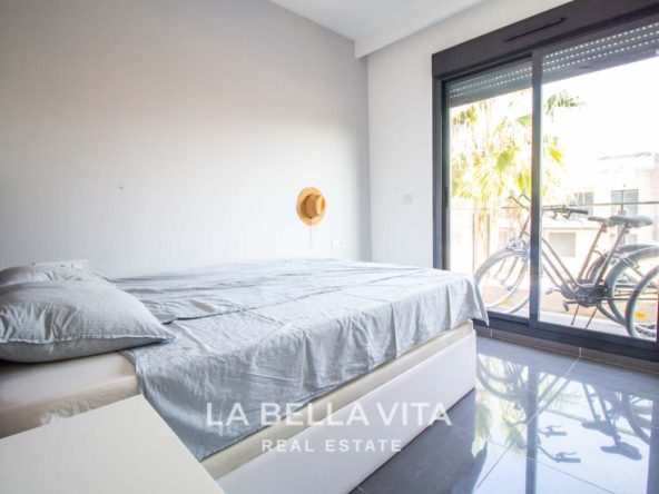 Modern Apartment with solarium for sale step away from the beach in Mil Palmeras, Alicante, Spain bedroom