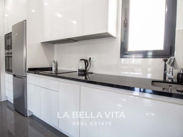 Modern Apartment with solarium for sale step away from the beach in Mil Palmeras, Alicante, Spain Kitchen