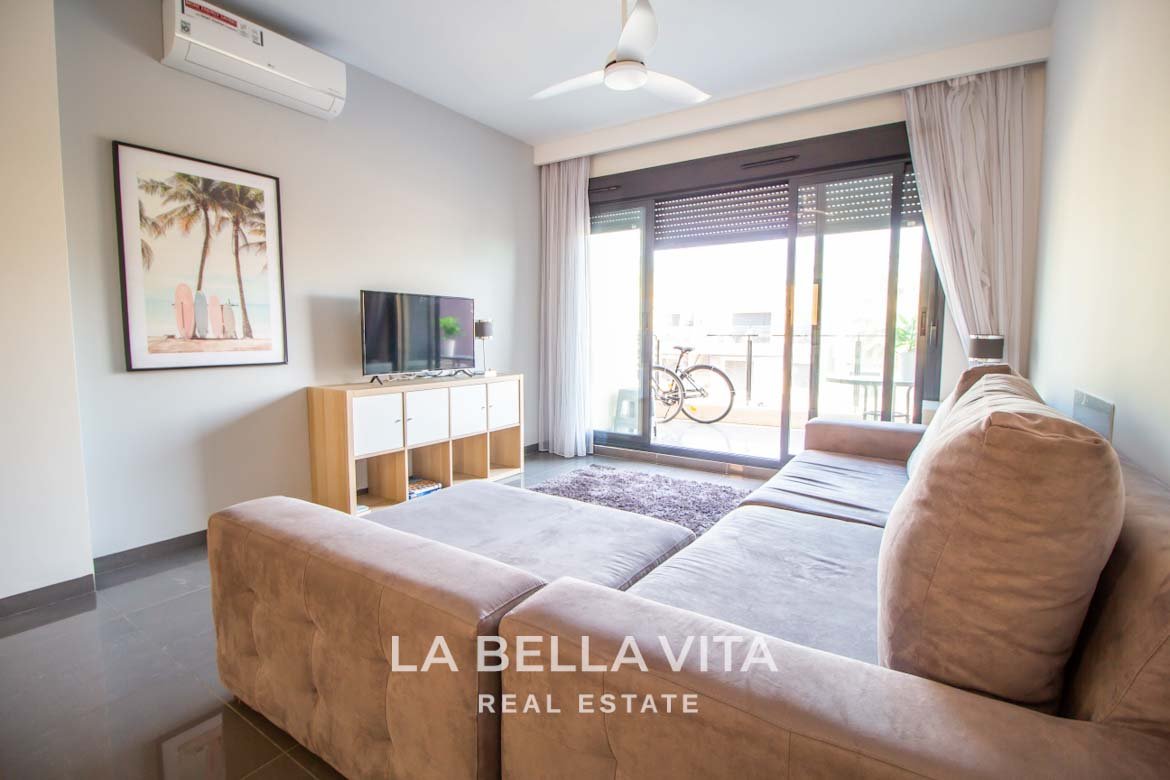 Modern Apartment with solarium for sale step away from the beach in Mil Palmeras, Alicante, Spain Living Room