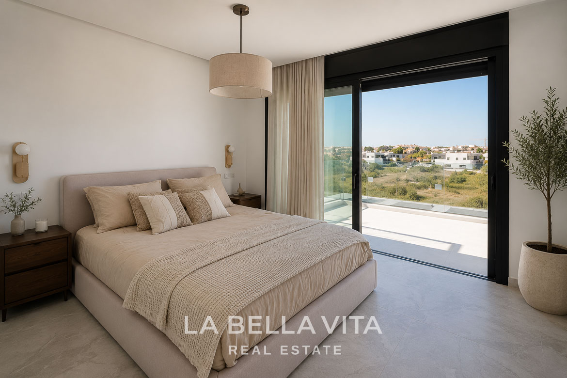 Bright and elegant bedroom with floor-to-ceiling glass doors opening to a spacious terrace in luxury new build villa, Aguas Nuevas Torrevieja