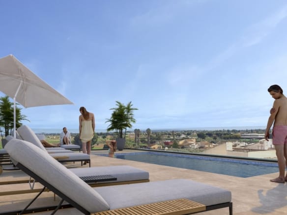 Rooftop terrace with pool, sun loungers and people overlooking Catral town