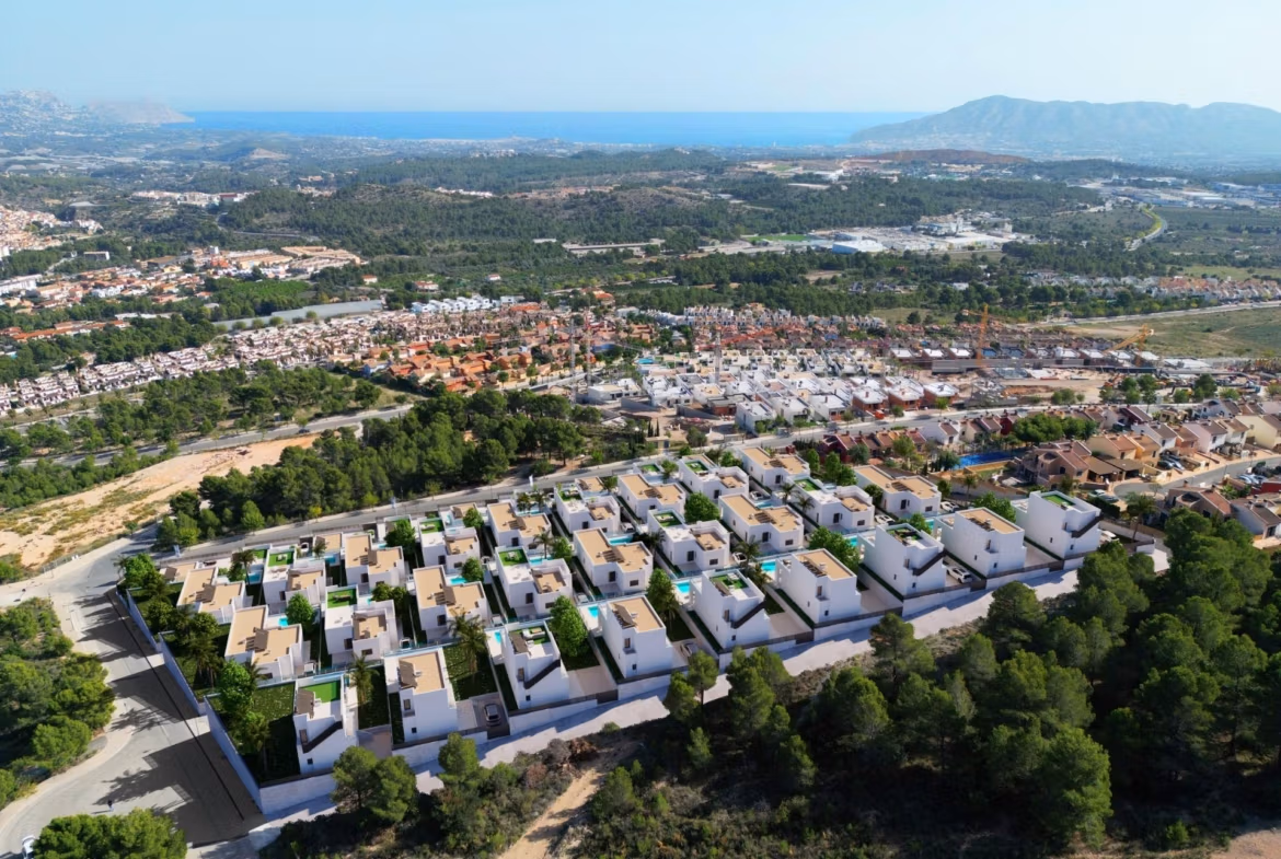 Stunning-New-Build-Villas-in-Polop-with-Sea-Views-40 Aerial view of modern new build villas with private pools surrounded by trees and sea views in Polop.