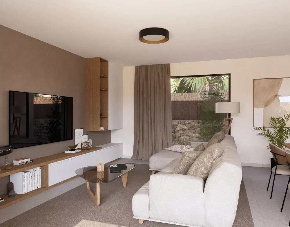 Living room with modern sofa, TV, and large window in a single-storey villa at Altaona Golf Resort, Murcia.