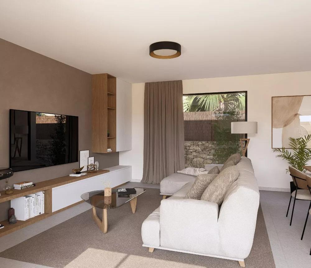 Living room with modern sofa, TV, and large window in a single-storey villa at Altaona Golf Resort, Murcia.