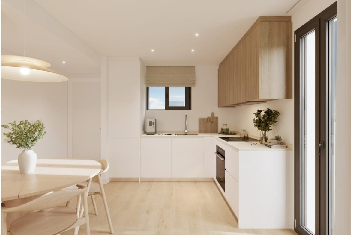 Bright modern kitchen and dining area in a spacious 3 bedroom new build apartment in Cala de Finestrat.
