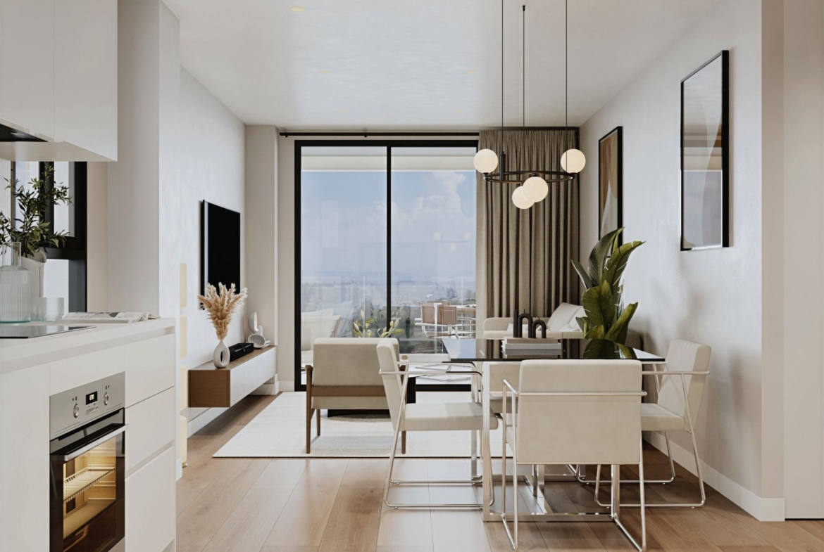 Bright open-plan living and dining area with modern kitchen in a 2-bedroom ground floor apartment in Cala de Finestrat.