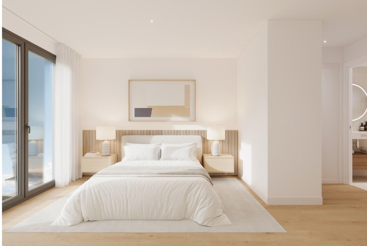 Bright bedroom with large window in a 2-bedroom ground floor apartment in Cala de Finestrat with garden access.