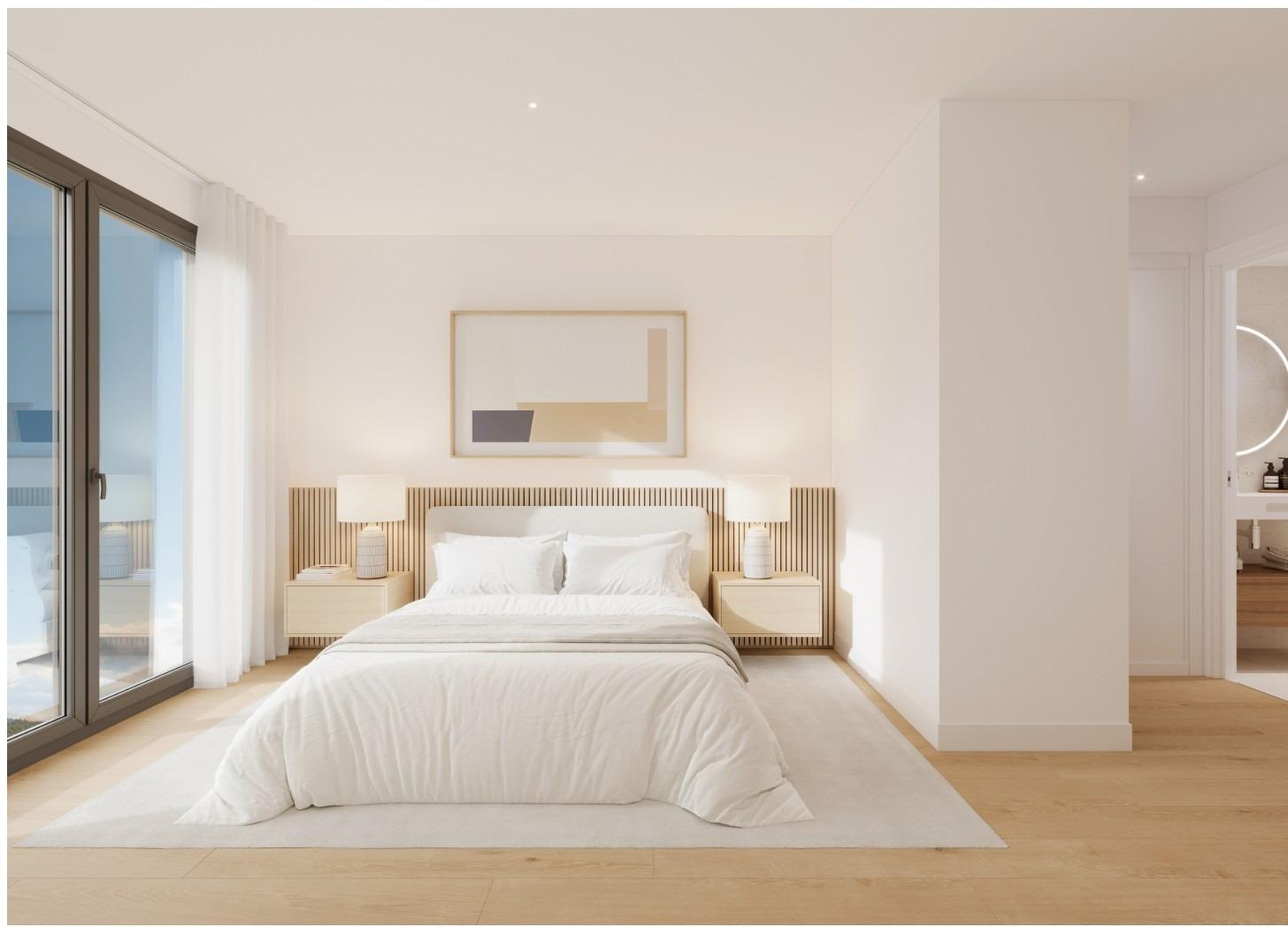 Bright bedroom with large window in a 2-bedroom ground floor apartment in Cala de Finestrat with garden access.