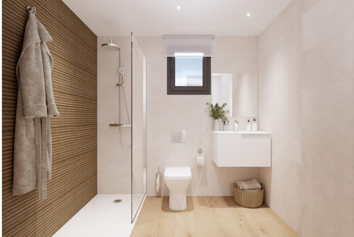 Modern bathroom with walk-in shower and wood accent wall in spacious 3 bedroom new build apartment in Cala de Finestrat