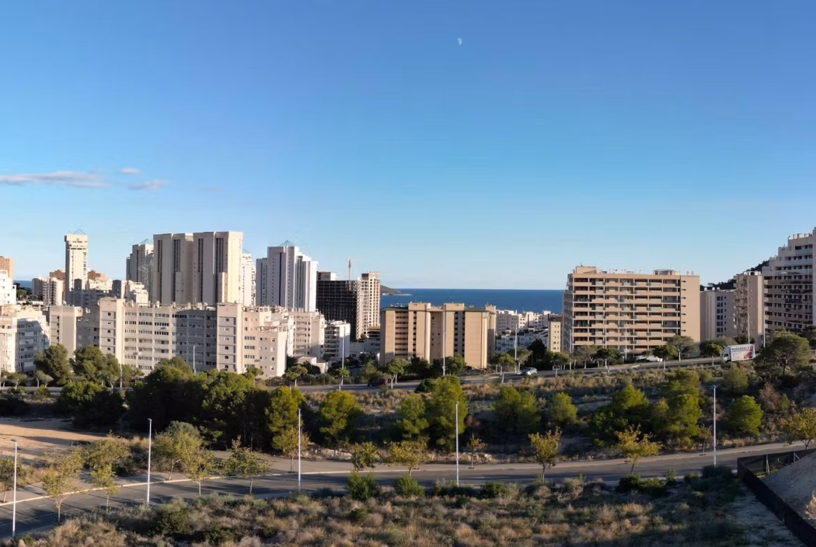 Urban skyline with residential buildings and sea view from elevated 2 bedroom penthouse solarium in Cala de Finestrat