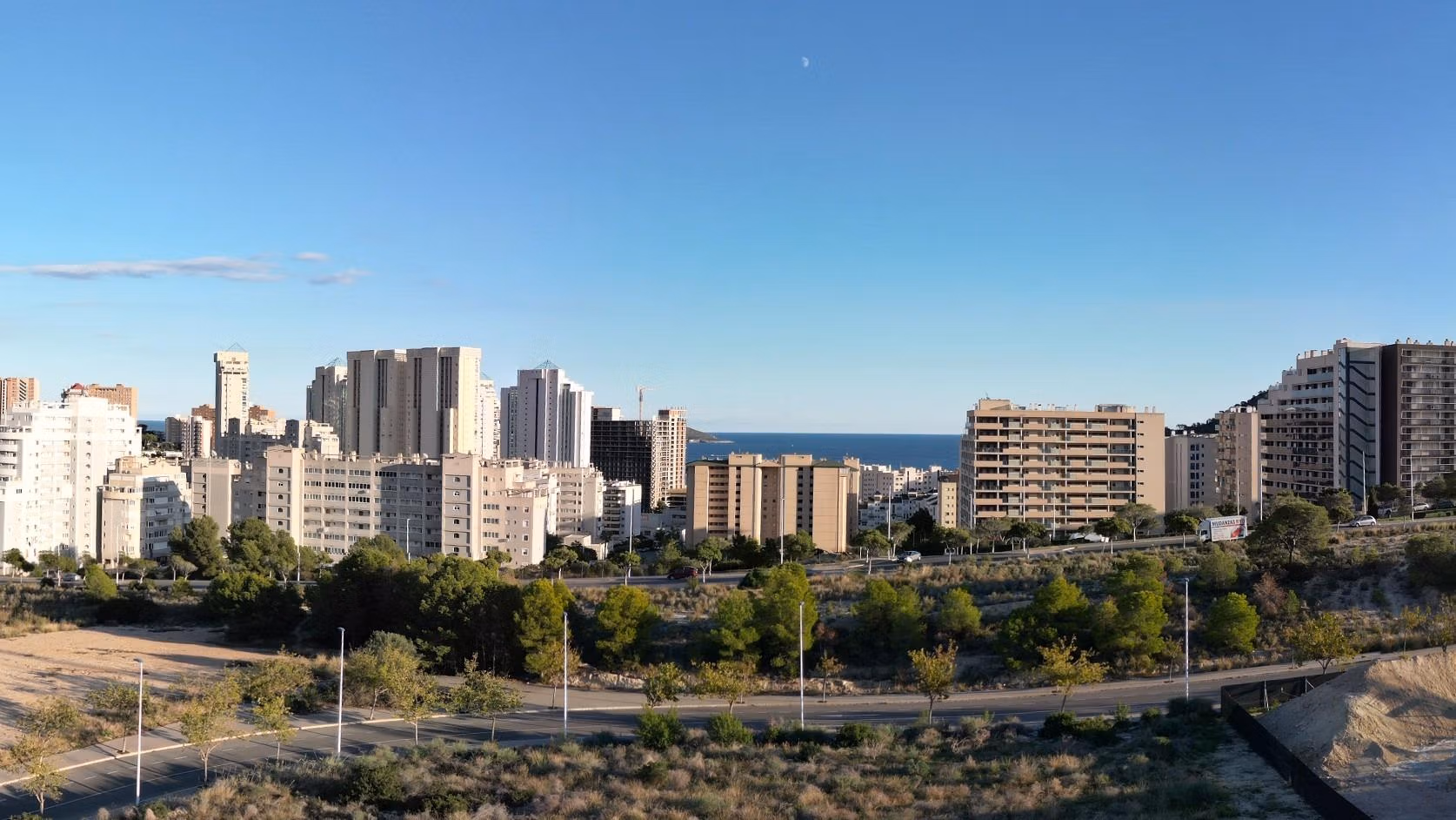 Luxury-New-Build-Apartments-in-Cala-Finestrat-Close-to-the-Beach-14 Urban skyline with residential buildings and sea view from elevated 2 bedroom penthouse solarium in Cala de Finestrat