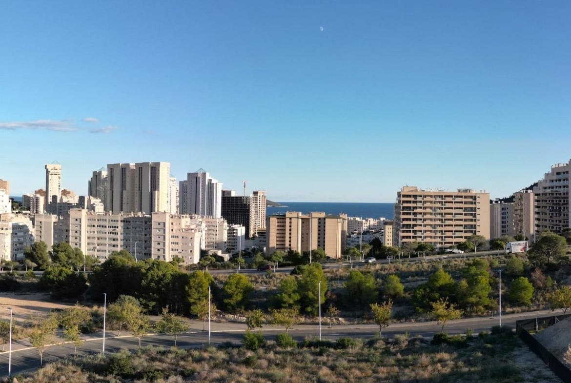 Cityscape with high-rise buildings and sea view from a 3 bedroom penthouse solarium in Cala de Finestrat