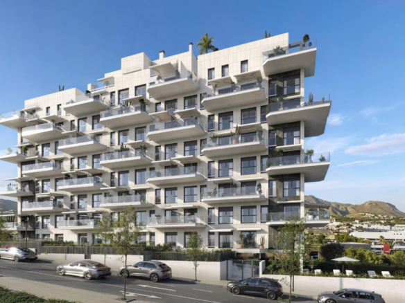 Modern exterior of a spacious 3 bedroom new build apartment complex in Cala de Finestrat with balconies and street parking.