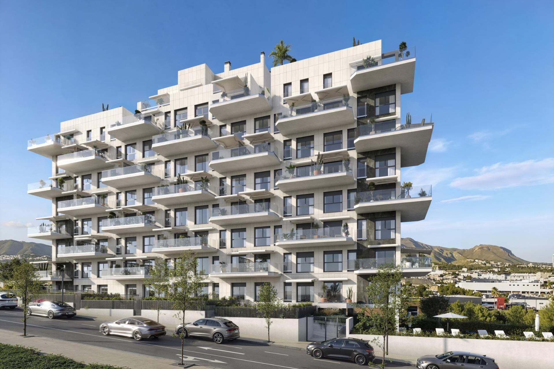 Luxury-New-Build-Apartments-in-Cala-Finestrat-Close-to-the-Beach-2 Modern exterior of a spacious 3 bedroom new build apartment complex in Cala de Finestrat with balconies and street parking.