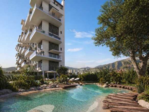 Modern 1 bedroom apartment building in Cala de Finestrat with landscaped pool and mountain views.