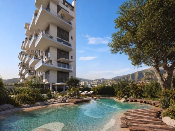 Modern 1 bedroom apartment building in Cala de Finestrat with landscaped pool and mountain views.