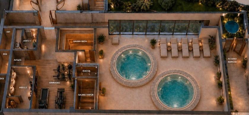 Aerial view of spa area with two circular pools and lounge chairs at the new build 2-bedroom ground floor apartment in Cala de Finestrat.