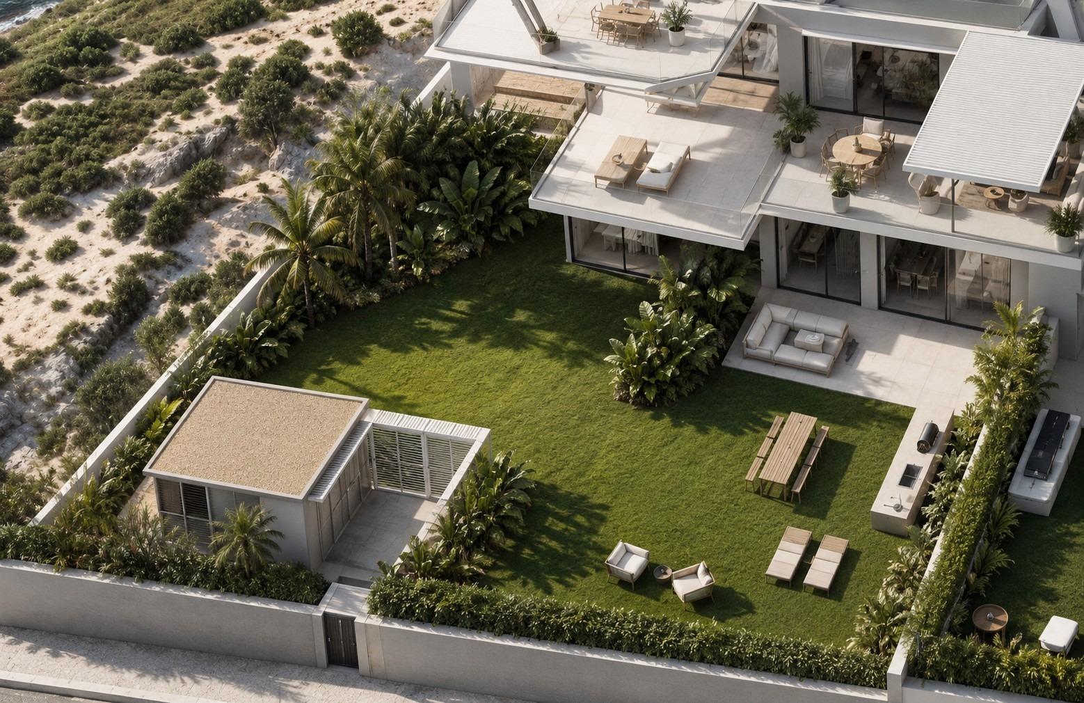 Terraced garden and outdoor seating of a smart new build 1-bedroom apartment in Cala de Finestrat with greenery and privacy walls.