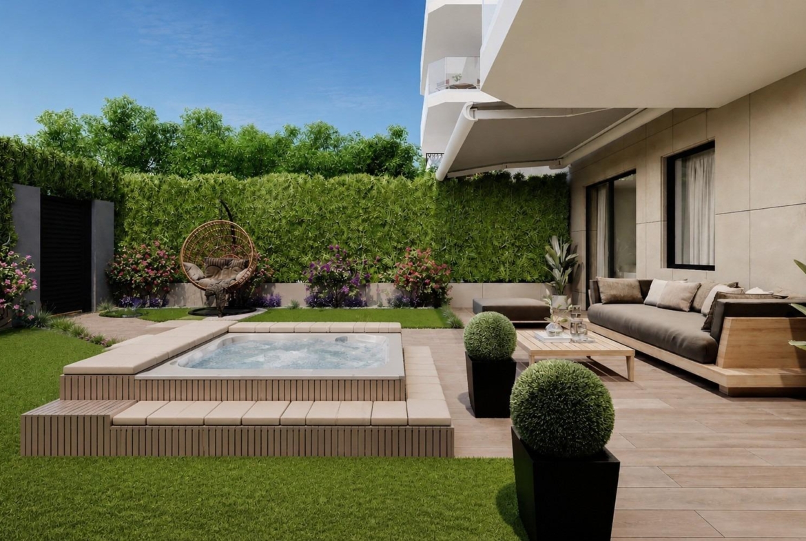 Garden terrace with seating and jacuzzi in a 2-bedroom ground floor apartment in Cala de Finestrat.