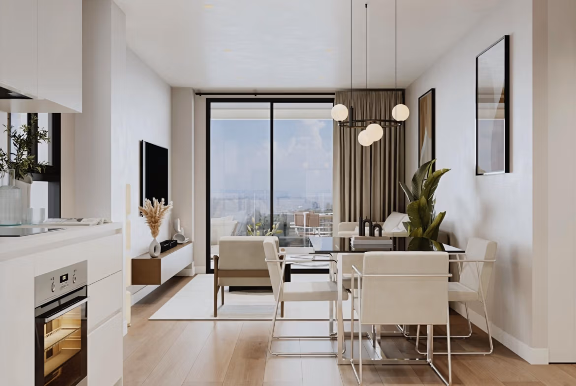 Bright open-plan living and dining area with modern kitchen in elevated 2-bedroom penthouse in Cala de Finestrat.