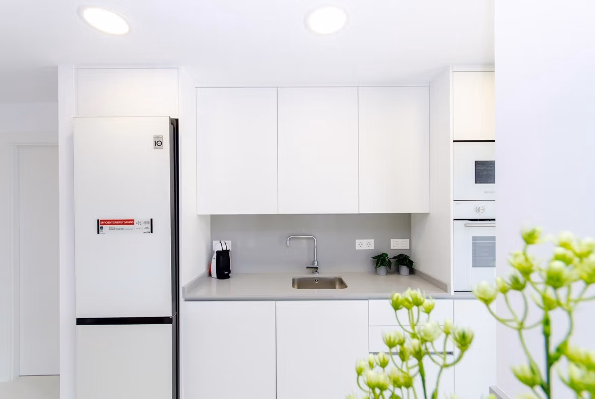 Luxury-New-Build-Semi-Detached-Villas-at-Vistabella-Golf-Resort-14 Modern kitchen with white cabinetry and built-in appliances in stylish new build semi-detached villa, Vistabella Golf Resort