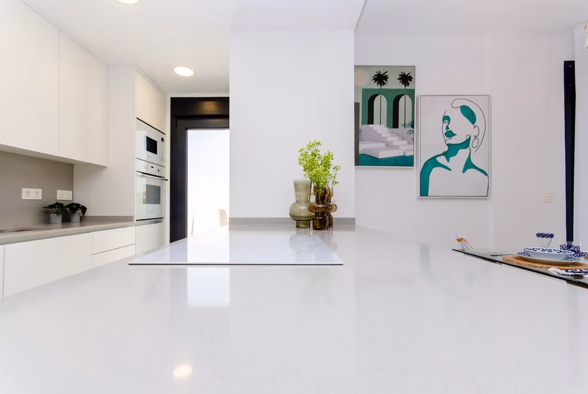Luxury-New-Build-Semi-Detached-Villas-at-Vistabella-Golf-Resort-20 Bright modern kitchen with white countertops and built-in appliances in a new semi-detached villa at Vistabella Golf Resort