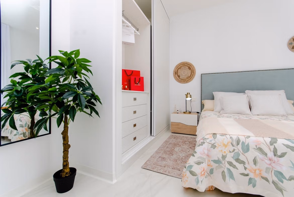 Luxury-New-Build-Semi-Detached-Villas-at-Vistabella-Golf-Resort-27 Bedroom with built-in wardrobe and decorative plant in new build semi-detached villa at Vistabella Golf Resort