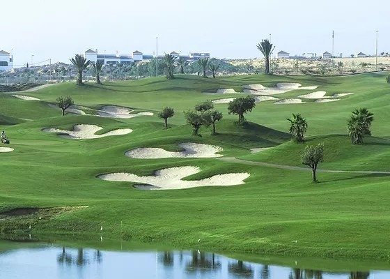 Golf course view with sand bunkers and water near the stylish new build semi-detached villa in Vistabella Golf Resort.