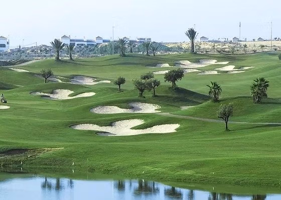 Luxury-New-Build-Semi-Detached-Villas-at-Vistabella-Golf-Resort-3 Golf course view with sand bunkers and water near the stylish new build semi-detached villa in Vistabella Golf Resort.