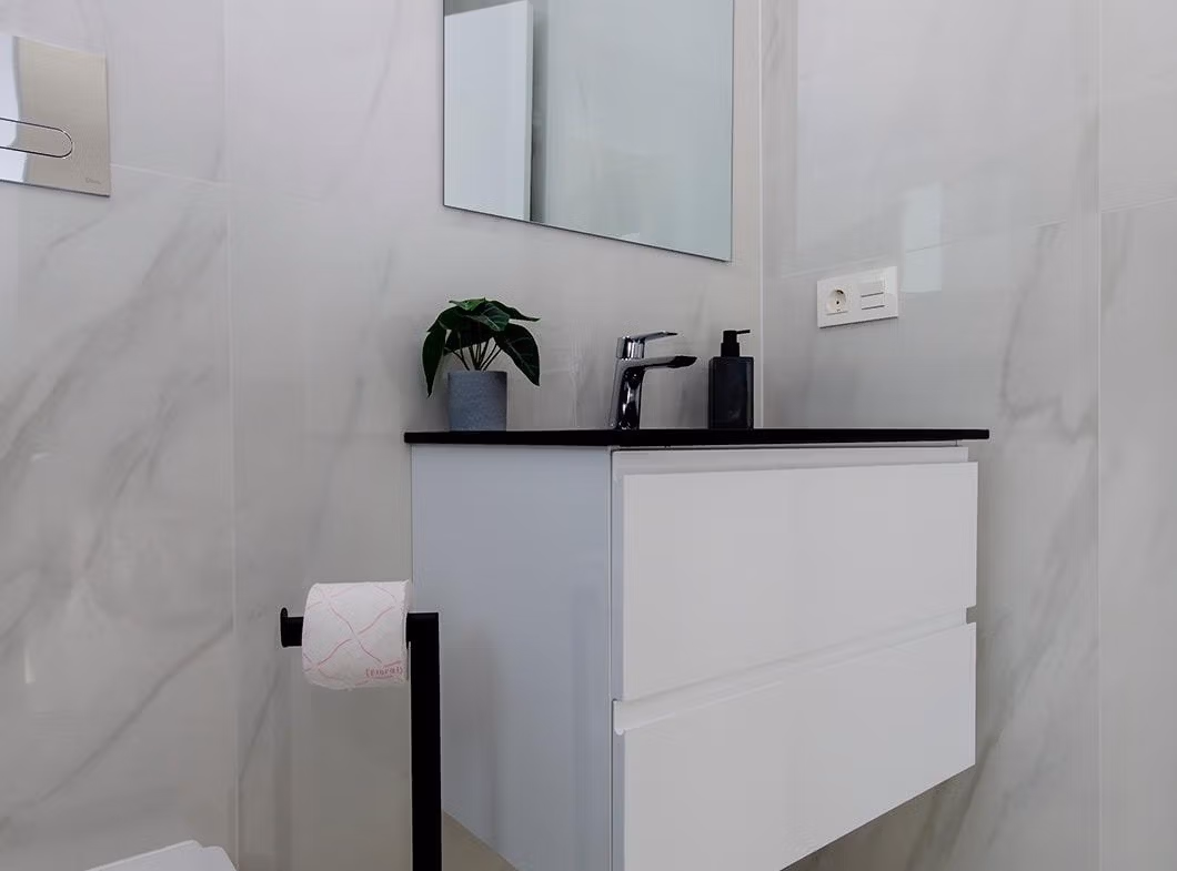 Luxury-New-Build-Semi-Detached-Villas-at-Vistabella-Golf-Resort-32 Modern bathroom with white floating vanity and mirror in stylish new build semi-detached villa at Vistabella Golf Resort