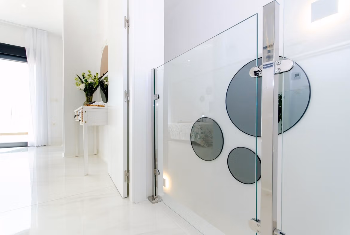 Luxury-New-Build-Semi-Detached-Villas-at-Vistabella-Golf-Resort-35 Bright modern interior hallway with glass railing in a stylish new build semi-detached villa at Vistabella Golf Resort