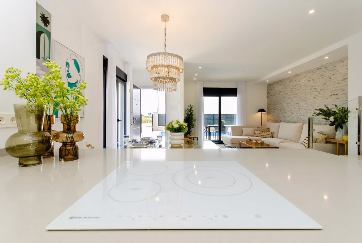 Luxury-New-Build-Semi-Detached-Villas-at-Vistabella-Golf-Resort-46 Open-plan kitchen and living area in a new build semi-detached villa at Vistabella Golf Resort with modern decor and natural light.