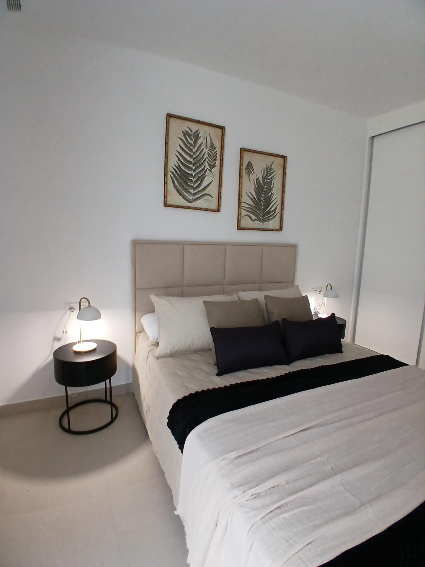 Modern-New-Build-Quad-Villas-in-Bigastro-Alicante-10 Bedroom with modern decor and neutral tones in a new build quad villa with basement for sale in Bigastro, Alicante