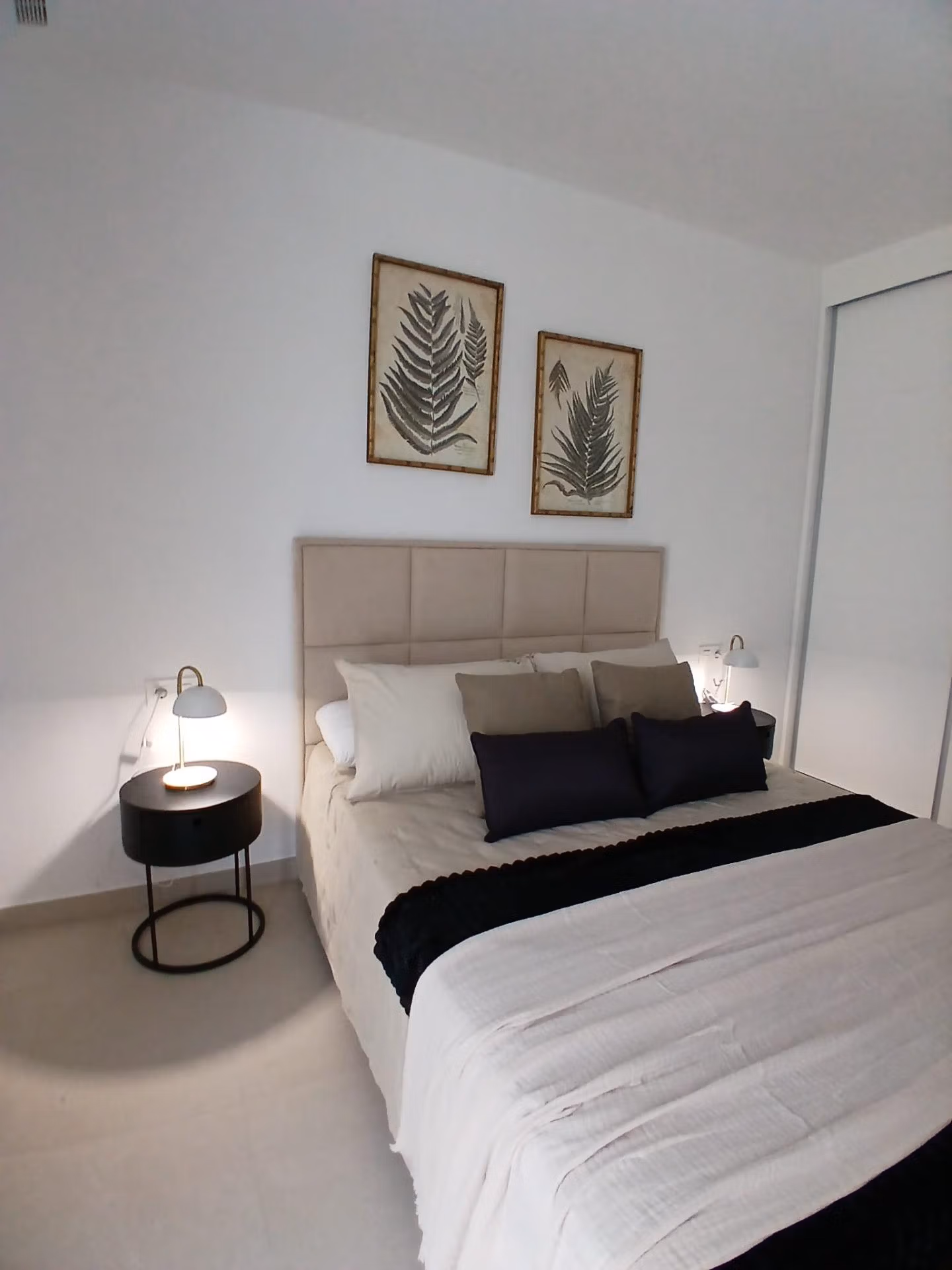 Bedroom with modern decor and neutral tones in a new build quad villa with basement for sale in Bigastro, Alicante