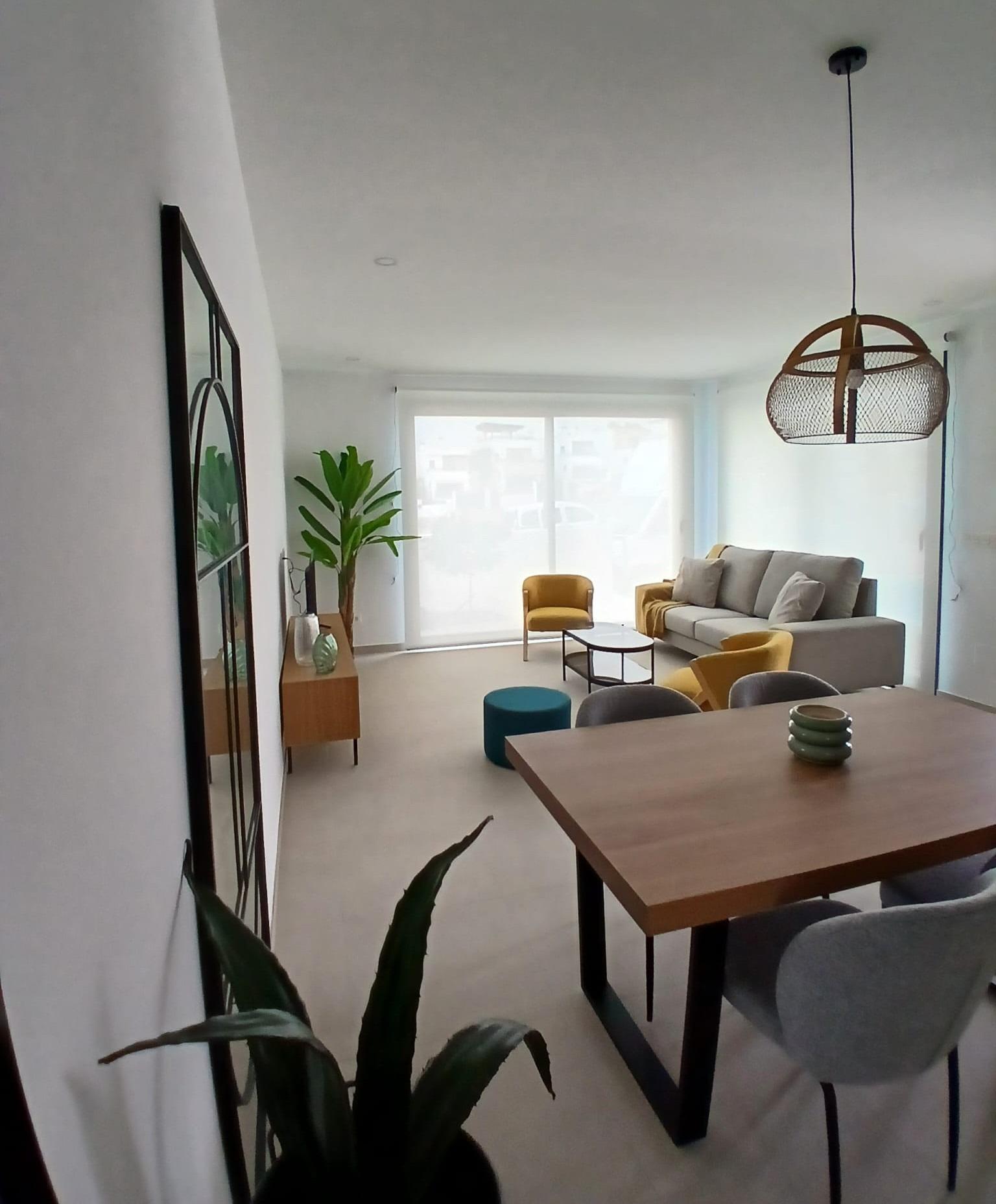 Modern-New-Build-Quad-Villas-in-Bigastro-Alicante-3 Bright living and dining area with modern furniture in a new build quad villa for sale in Bigastro, Alicante