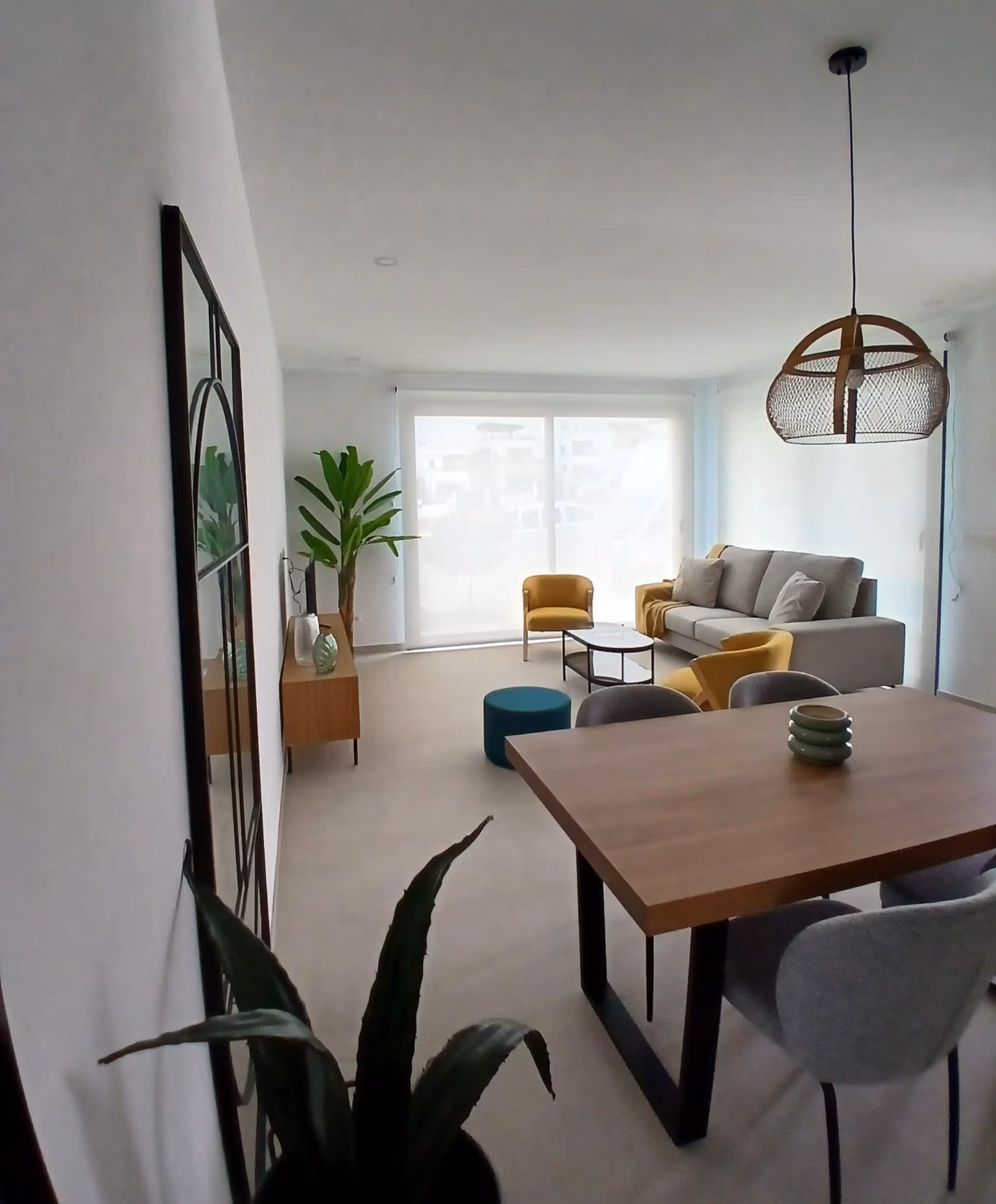 Bright living and dining area with modern furniture in a new build quad villa for sale in Bigastro, Alicante