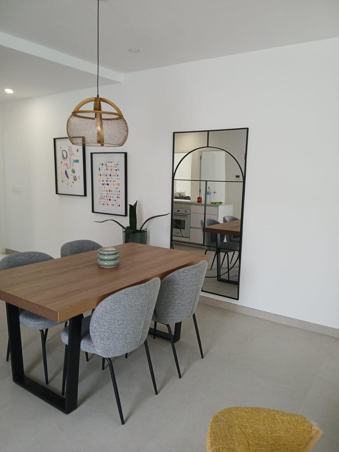 Modern-New-Build-Quad-Villas-in-Bigastro-Alicante-4 Dining area with modern table and chairs in a new build quad property in Bigastro, Alicante