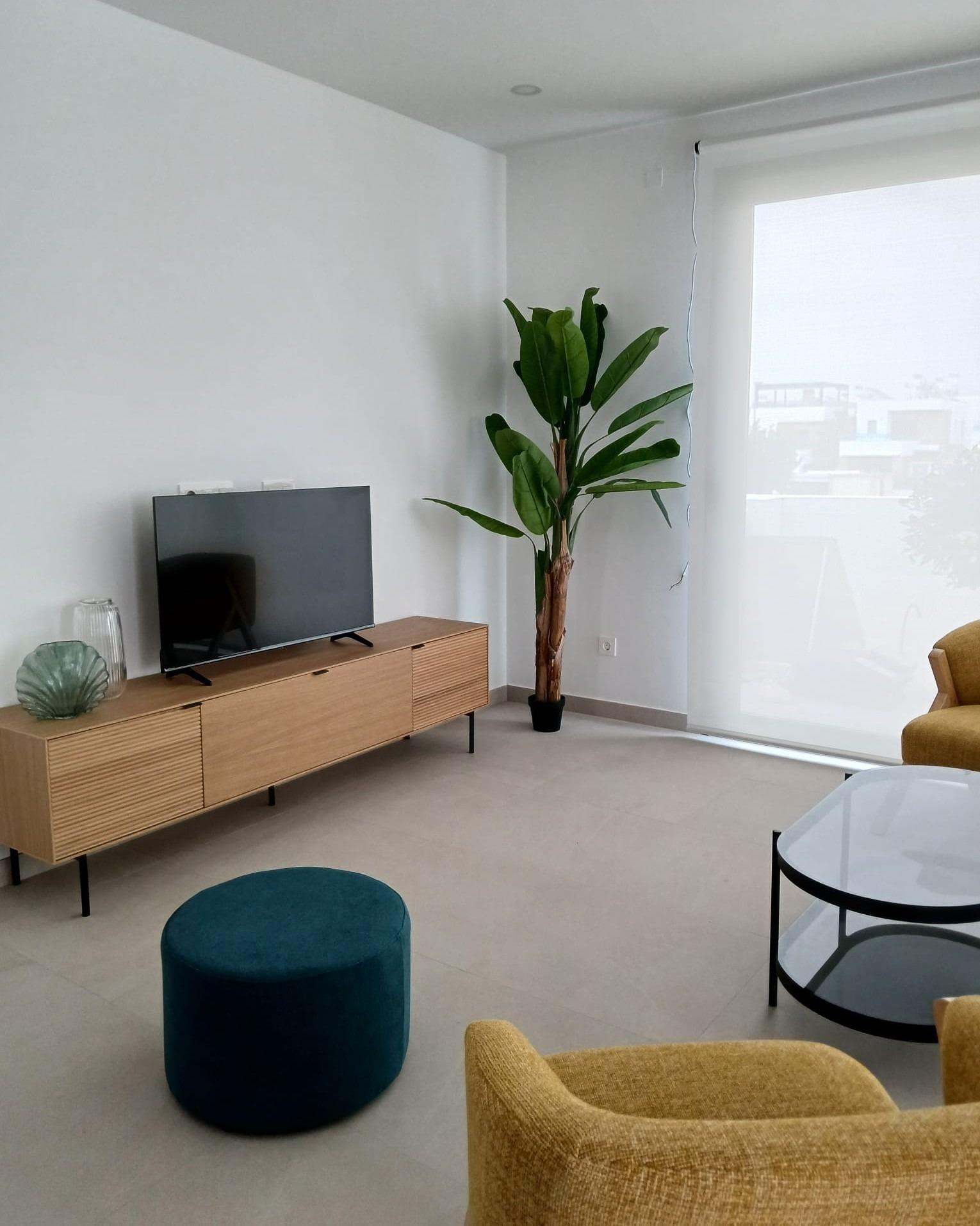 Modern-New-Build-Quad-Villas-in-Bigastro-Alicante-5 Living room with modern furniture and large window in versatile new build quad property in Bigastro, Alicante