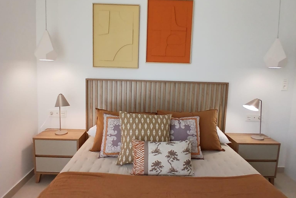 Bedroom interior with double bed and bedside tables in a modern new build quad property in Bigastro, Alicante