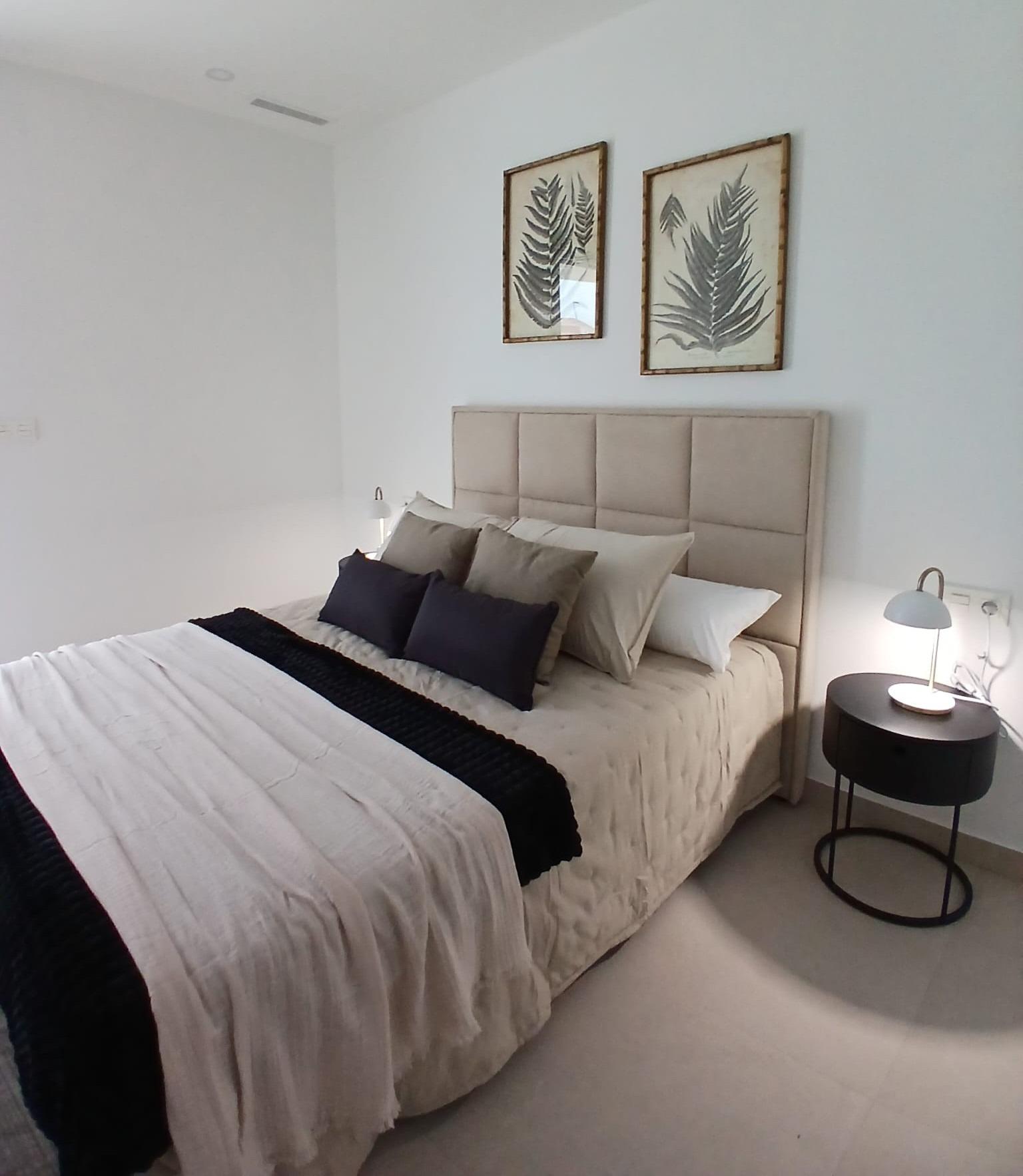 Modern-New-Build-Quad-Villas-in-Bigastro-Alicante-9 Bright bedroom with double bed and minimalist decor in a new build quad villa with basement for sale in Bigastro, Alicante