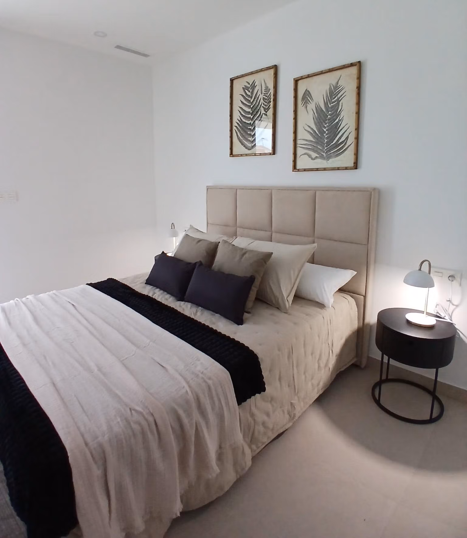 Bright bedroom with double bed and minimalist decor in a new build quad villa with basement for sale in Bigastro, Alicante