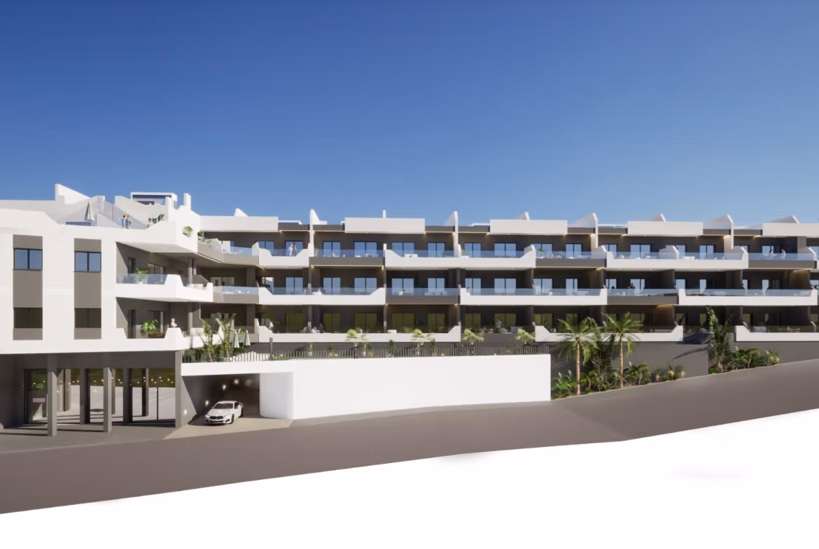Modern white three-story apartment building with balconies and parking, a new 2 bedroom apartment for sale in Benijofar, Alicante