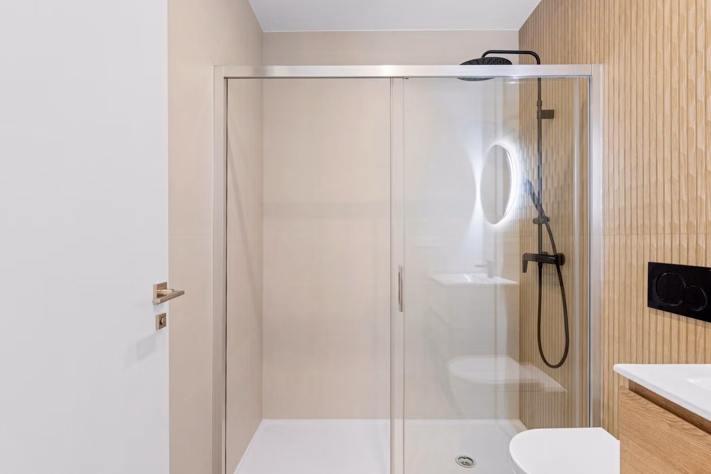 Modern bathroom with walk-in shower and wood accents in a 3 bedroom apartment in Benijofar, Costa Blanca South.