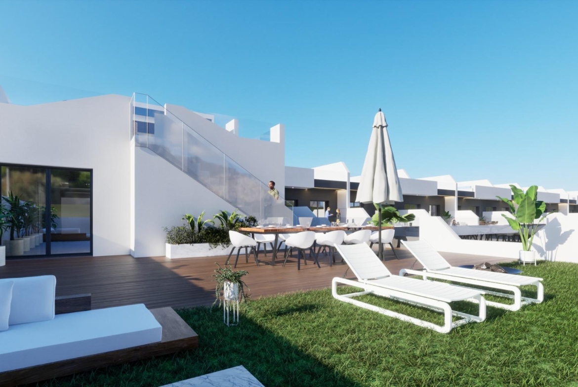 Outdoor terrace with sun loungers and seating area at new build 2 bedroom ground floor apartment in Benijofar