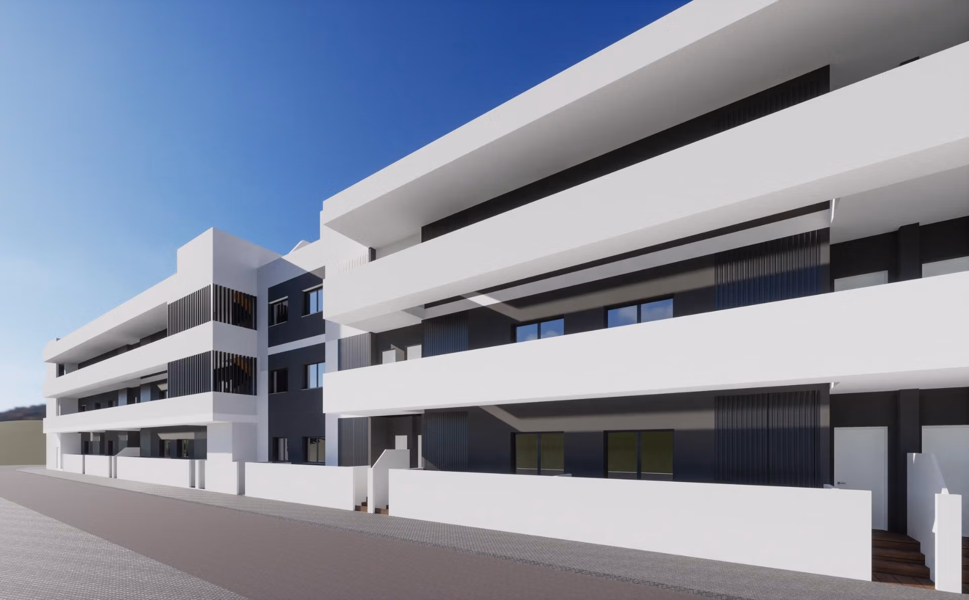 Modern white exterior of a new build 2 bedroom apartment building in Benijofar, Alicante with spacious balconies.