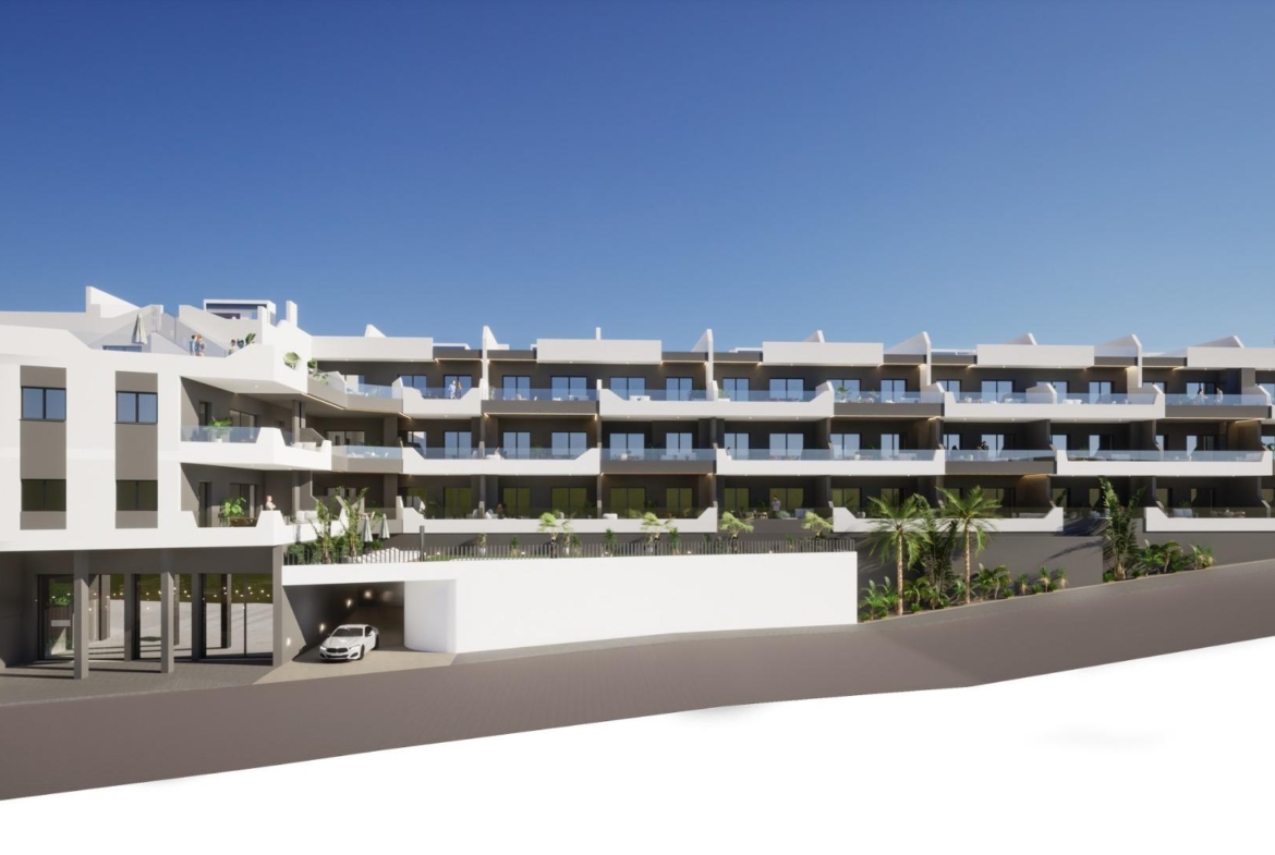 Exterior view of modern new build 2 bedroom ground floor apartment complex in Benijofar with balconies and parking area