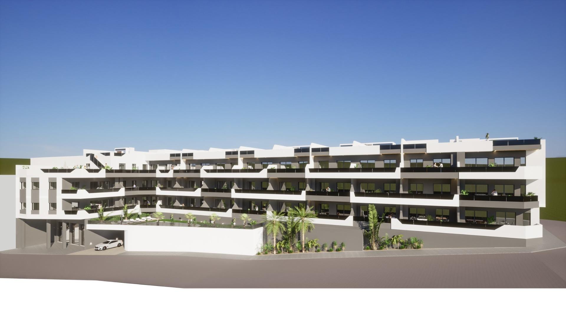 Modern white multi-story residential building with terraces and greenery, new 3 bedroom penthouse with solarium for sale in Benijofar
