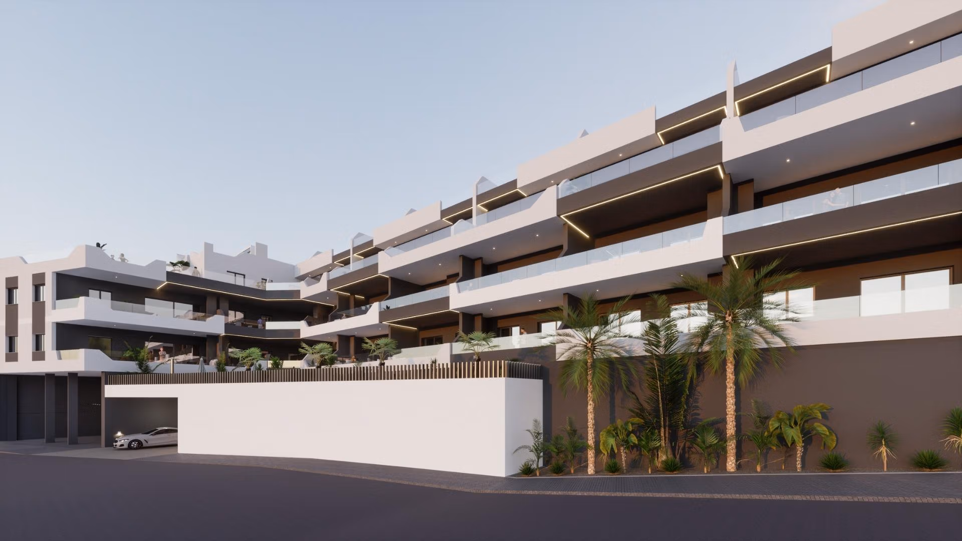 Modern exterior of a bright new build 2 bedroom apartment complex in Benijofar, Alicante with balconies and palm trees.