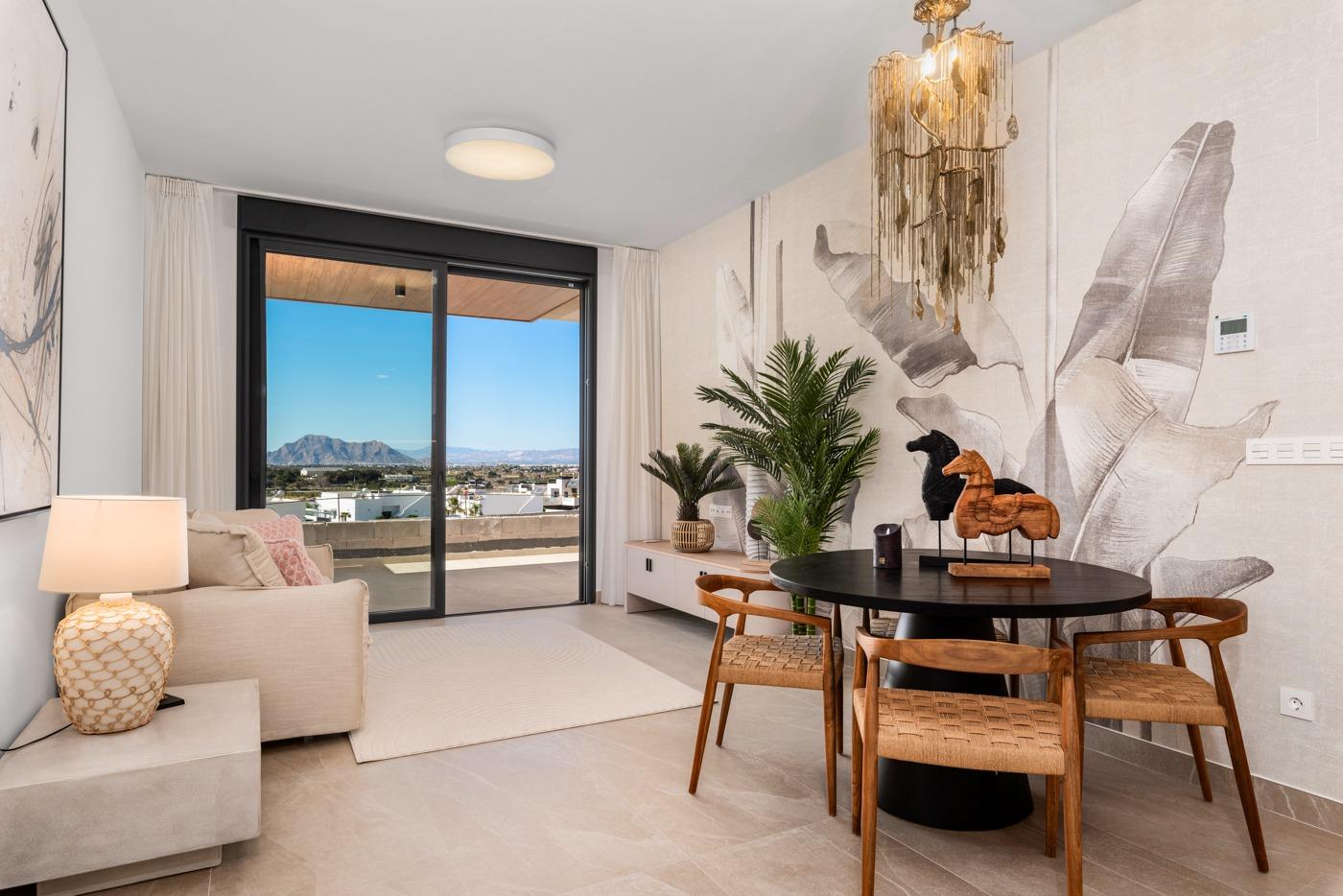 Bright living and dining area with sliding doors to terrace in a 2-bedroom ground floor apartment in Benijofar